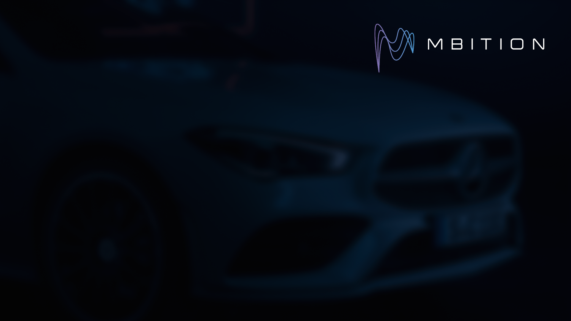 Desktop background with Mbition logo and a car